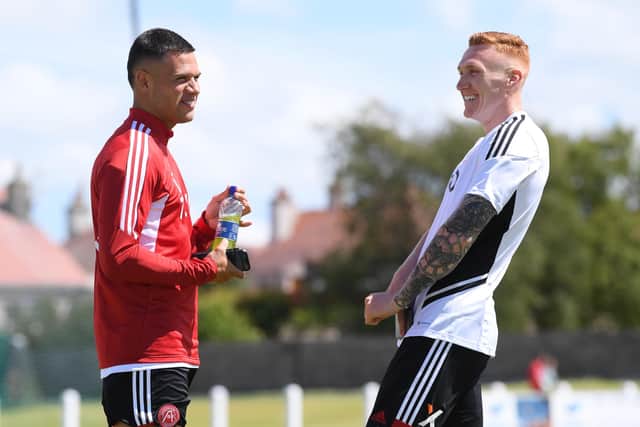 Aberdeen duo Christian Ramirez and David Bates have not featured in the last two squads. (Photo by Ross Parker / SNS Group)