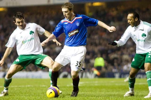 Steven Davis challenged by Georgios Karagounis and Nasief Morris of Panathinaikos during his debut for Rangers in a UEFA Cup match at Ibrox on February 13, 2008. (Photo by SNS Group).
