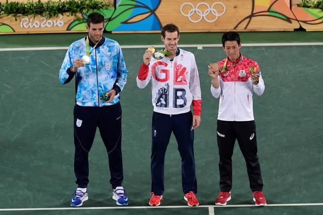 Andy Murray, centre, shows off his gold medal at the Rio 2016 Olympic Games.