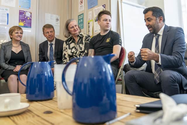 First Minister Humza Yousaf (right) meets staff and residents during a visit to Gilven House supported accommodation facility in Glenrothes, Fife