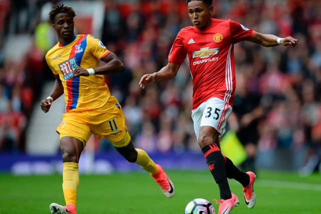 Demetri Mitchell impressed against Crystal Palace's Wilfried Zaha on his English Premier League debut for Manchester United.