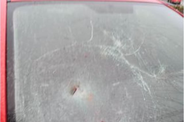 Cars suffered cracked windscreens after being hit with flying tiles.