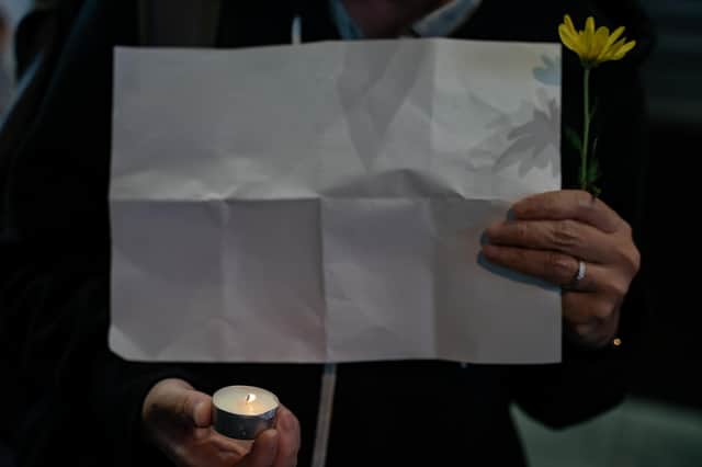 A protester in Hong Kong holds up a blank piece of paper (Picture: Anthony Kwan/Getty Images)