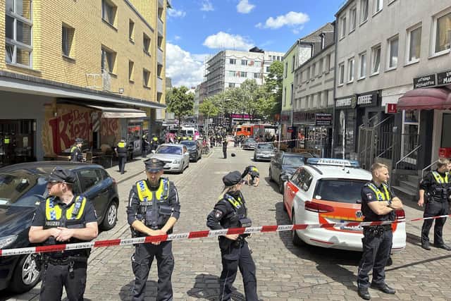 Police cordon off an area near the Reeperbahn in Hamburg, Germany where officers have shot and wounded a man (Pic: Steven Hutchings/dpa via AP)
