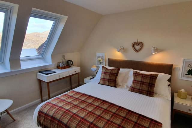 Cosy with clean lines and loch and mountain views, one of the seven en suite rooms at Newton Lodge.