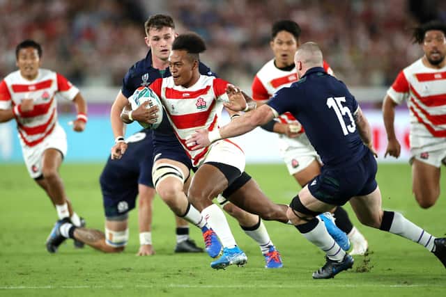 Kotaro Matsushima evades Stuart Hogg during Japan's win over Scotland at the 2019 Rugby World Cup. Picture: Cameron Spencer/Getty Images