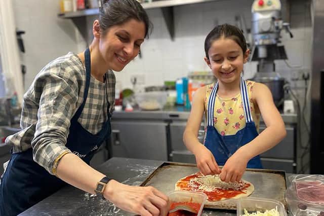Nazanin Zaghari-Ratcliffe makes pizza with her seven-year-old daughter Gabriella (Picture: PA)