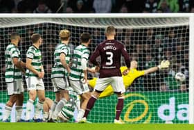 Stephen Kingsley curls home this free-kick to make it 2-0 to Hearts at Celtic Park.