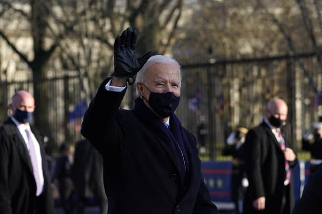 Joe Biden walks the parade route after his inauguration
