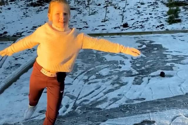 Nine-year-old Madison Galt figure skating on her frozen street in East Kilbride