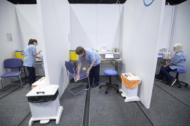 Members of the Vaccination Team in the vaccine areas at the coronavirus mass vaccine centre at the Edinburgh International Conference Centre. Picture date: Monday February 1, 2021.