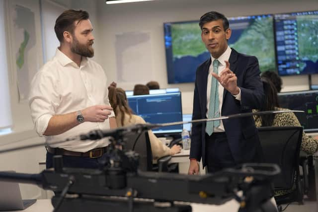 Prime Minister Rishi Sunak (right) speaks to Border Force officials at the Small Boats Operational Command Border Force facility in London. Picture: Alastair Grant - WPA Pool/Getty Images