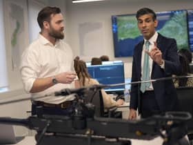 Prime Minister Rishi Sunak (right) speaks to Border Force officials at the Small Boats Operational Command Border Force facility in London. Picture: Alastair Grant - WPA Pool/Getty Images