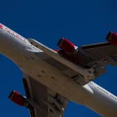 The Virgin Orbit - a modified Boeing 747 - carries a Launcher One rocket under it's wing containing small satellites to be sent into space. (Pic: Getty)
