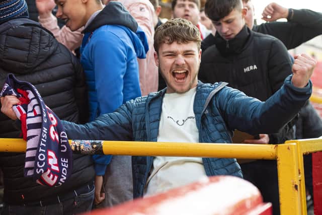 A Ross County fan during a cinch Premiership match between Aberdeen and Ross County at Pittodrie.