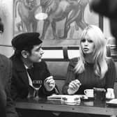 French actress Brigitte Bardot chats with actor Antoine Bourseiller during filming of Masculin-Feminin, directed by Jean-Luc Godard, left, in Paris in 1965 (Picture: AFP via Getty Images)