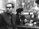 French actress Brigitte Bardot chats with actor Antoine Bourseiller during filming of Masculin-Feminin, directed by Jean-Luc Godard, left, in Paris in 1965 (Picture: AFP via Getty Images)