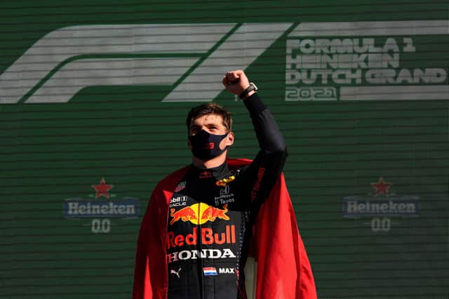 Race winner Max Verstappen of Red Bull Racing celebrates on the podium after the F1 Grand Prix of The Netherlands at Circuit Zandvoort. (Photo by Francisco Seco - Pool/Getty Images)
