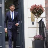 Prime Minister Rishi Sunak leaves the Conservative Party headquarters in central London, after the party suffered council losses in the local elections.