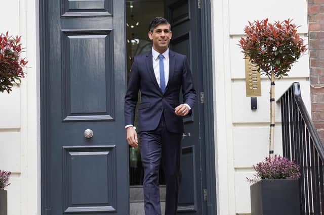 Prime Minister Rishi Sunak leaves the Conservative Party headquarters in central London, after the party suffered council losses in the local elections.