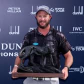 Ockie Strydom shows off the trophy after landing his maiden DP World Tour win in the Alfred Dunhill Championship at Leopard Creek Country Club in Malelane, South Africa. Picture: Warren Little/Getty Images.