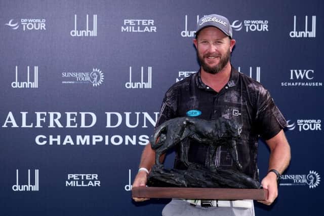 Ockie Strydom shows off the trophy after landing his maiden DP World Tour win in the Alfred Dunhill Championship at Leopard Creek Country Club in Malelane, South Africa. Picture: Warren Little/Getty Images.