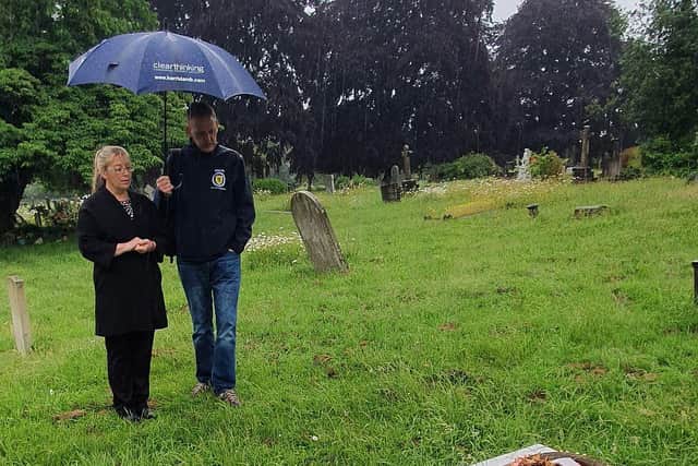 Scotland fan Alistair Firth with Emma Wilson from the Richmond cemetery office