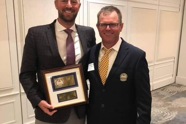 Neil Lockie, left, after receiving the South Florida PGA South East Chapter Professional of the Year Award in 2018, when he was at Jonathan's Landing in Jupiter.
