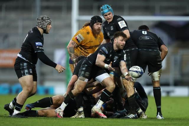 Ali Price of Glasgow Warriors passes the ball during the Heineken Champions Cup Pool B match between Exeter Chiefs and Glasgow Warriors at Sandy Park on December 13, 2020 in Exeter, England. (Photo by David Rogers/Getty Images)