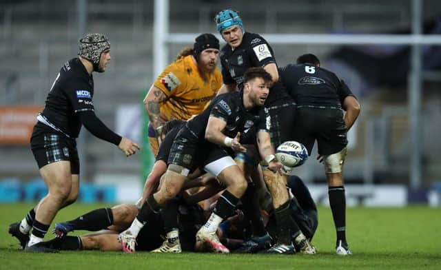 Ali Price of Glasgow Warriors passes the ball during the Heineken Champions Cup Pool B match between Exeter Chiefs and Glasgow Warriors at Sandy Park on December 13, 2020 in Exeter, England. (Photo by David Rogers/Getty Images)