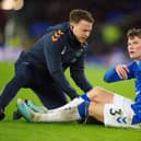 Everton's Nathan Patterson receives treatment during the 4-1 defeat to Brighton. Picture date: Tuesday January 3, 2023.