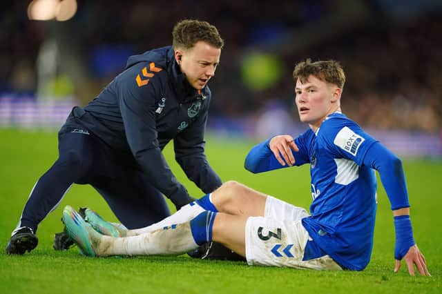 Everton's Nathan Patterson receives treatment during the 4-1 defeat to Brighton. Picture date: Tuesday January 3, 2023.