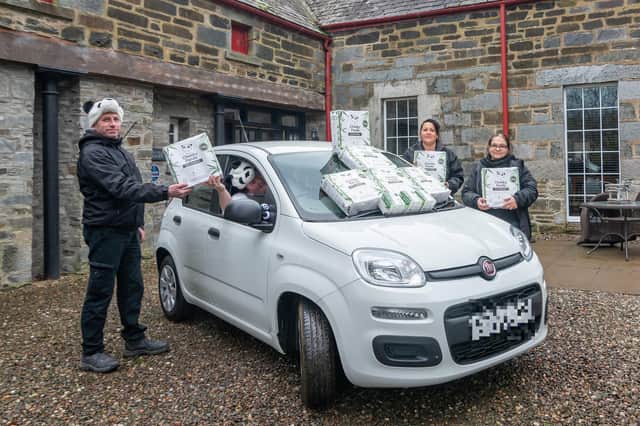Mains of Taymouth’s three housekeeping supervisors, Roland, Mariana and Judit are pictured with the Cheeky Panda toilet roll, along with general manager Pauline McLaren behind the wheel of one of the estate’s white Panda cars. Pic: Laura N Ramsay.