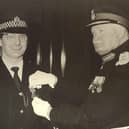 Sandy Marr being presented with the British Empire Medal by Lord Kilmany on April 7, 1977.