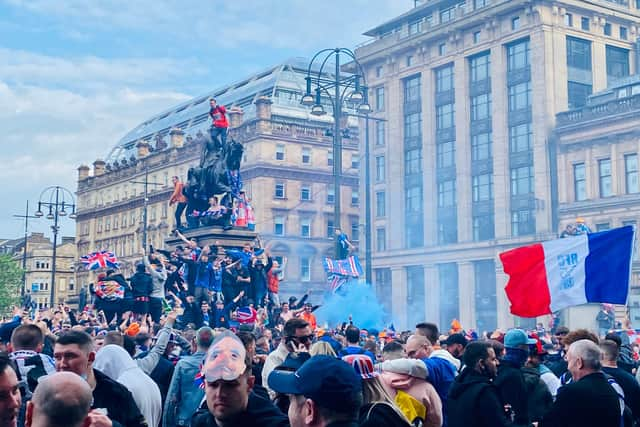 Police in Glasgow concerned about public health as they move crowds of Rangers fans to George Square