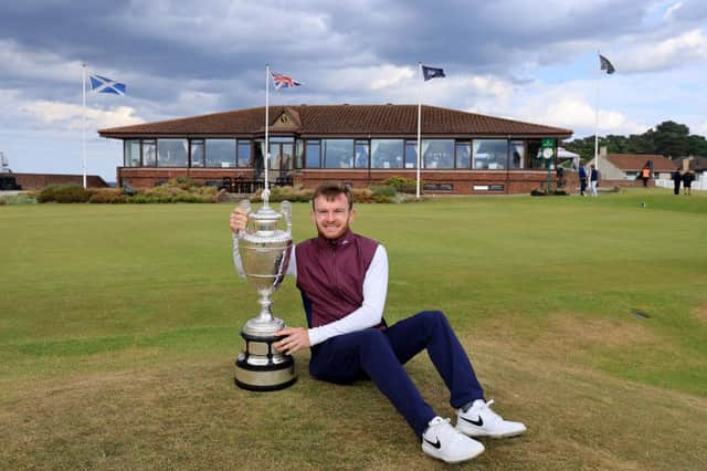 Laird Shepherd poses with the trophy after his victory in the final of the R&A Amateur Championship at Nairn. David Cannon/R&A/R&A via Getty Images.