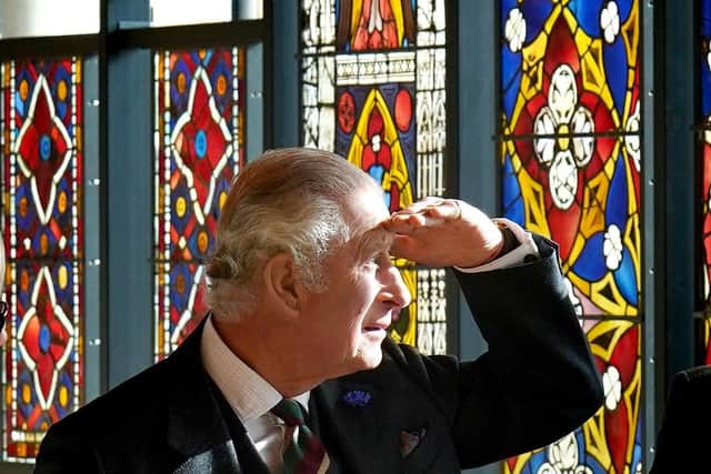 King Charles III views stain glass windows during a visit to the Burrell Collection