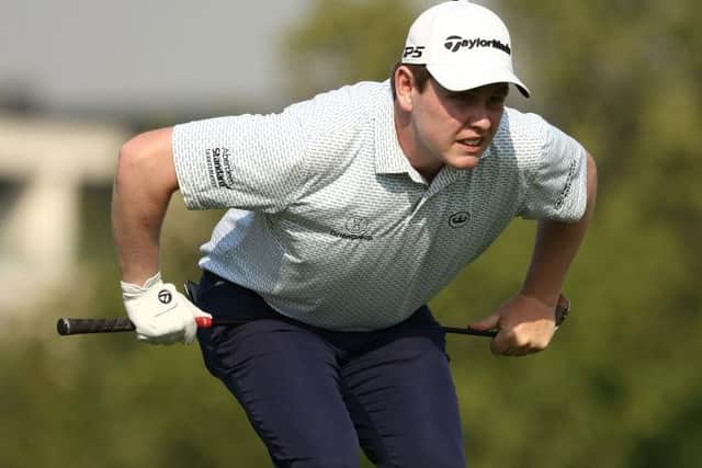 Bob Macintyre reacts after playing a shot in the DP World Tour Championship at Jumeirah Golf Estates in Dubai last month. Picture: Francois Nel/Getty Images.