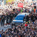 The Queen's coffin is taken from the Palace of Holyroodhouse to St Giles' Cathedral on the Royal Mile in Edinburgh. Image: Scott Louden/The Scotsman.