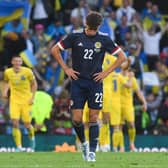 A dejected Aaron Hickey during Scotland's 3-1 defeat to Ukraine in the World Cup play-off semi-final.