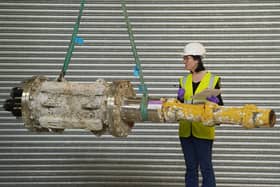 Dr Ellie Swinbank with part of the MeyGen tidal turbine, acquired by NMS. PIC: Stewart Attwood