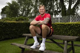 New Hearts defender Frankie Kent was sold on a move to Tynecastle by former team-mates.