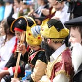 Jewish school children gather and sit in fancy dress during a schools' annual Purim event (Photo: Shutterstock)