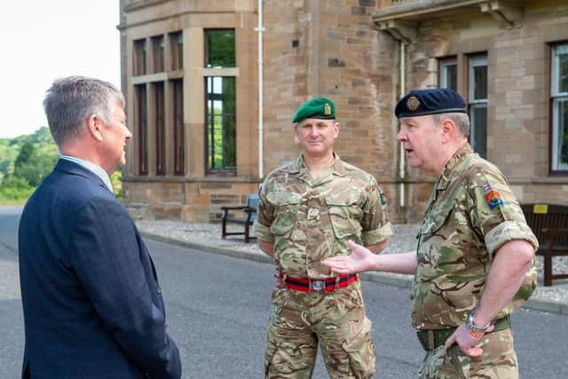 Keith Brown MSP, Cabinet Secretary for Justice and Veterans speaking to Personnel Recovery Officer Neil Davies and Officer Commanding Del Hamilton.