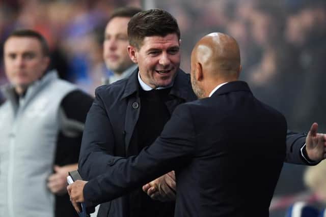 Rangers manager Steven Gerrard warmly greets Lyon head coach Peter Bosz before Thursday night's Europa League match between their teams at Ibrox. (Photo by Craig Foy / SNS Group)