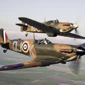 A Spitfire (front) flying alongside a Hurricane from the Battle of Britain Memorial Flight, over RAF Conningsby.
Pic: MoD