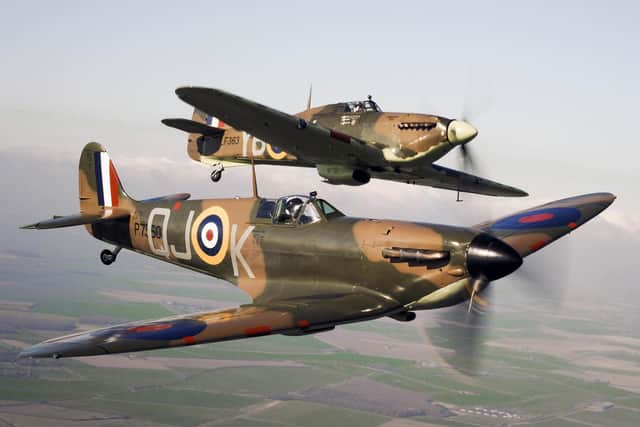 A Spitfire (front) flying alongside a Hurricane from the Battle of Britain Memorial Flight, over RAF Conningsby.
Pic: MoD