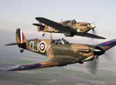 A Spitfire (front) flying alongside a Hurricane from the Battle of Britain Memorial Flight, over RAF Conningsby.
Pic: MoD