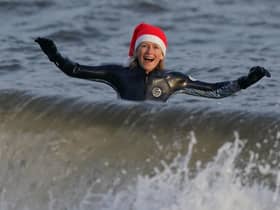 A wild swimmer takes a Christmas Day dip at Portobello Beach in Edinburgh.  Andrew Milligan/PA Wire