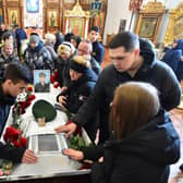 Relatives of Russian serviceman Nikita Avrov, 20, who was killed in Ukraine in March, at his funeral service in the town of Luga (Picture: AFP via Getty Images)
